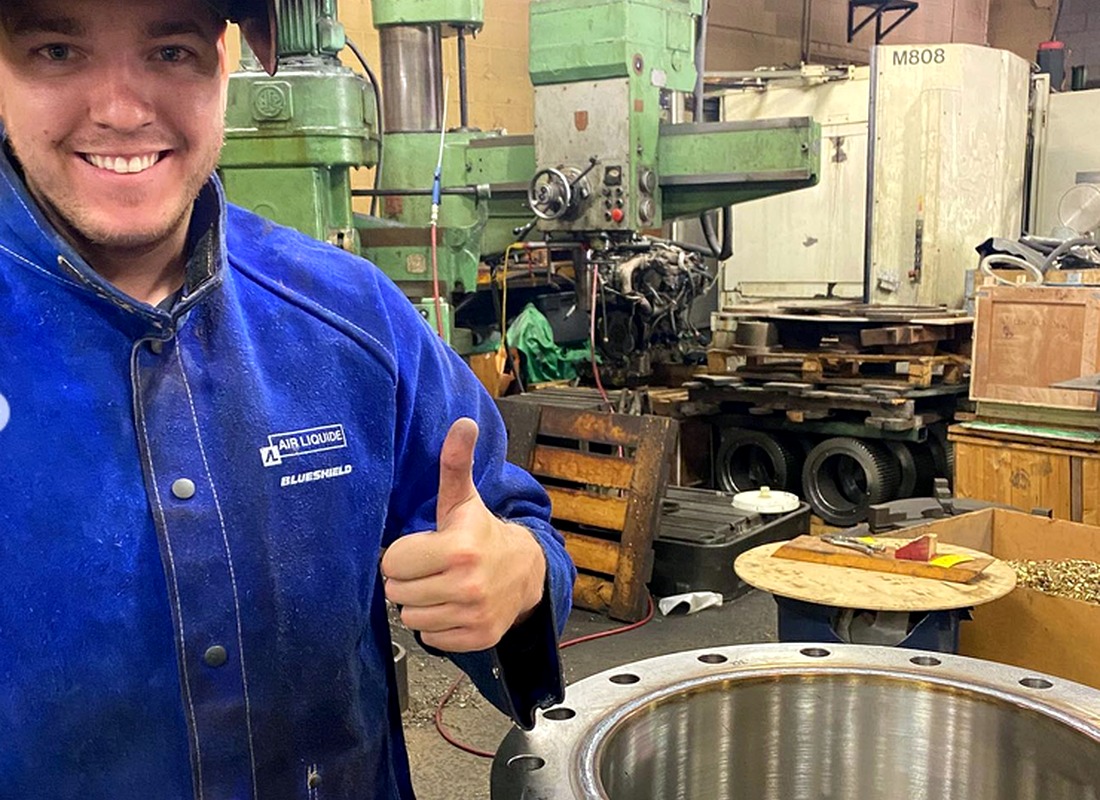 Welcan team member with aluminum welding work